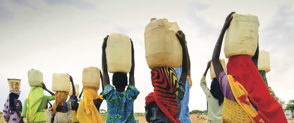 Women carrying jugs of water.