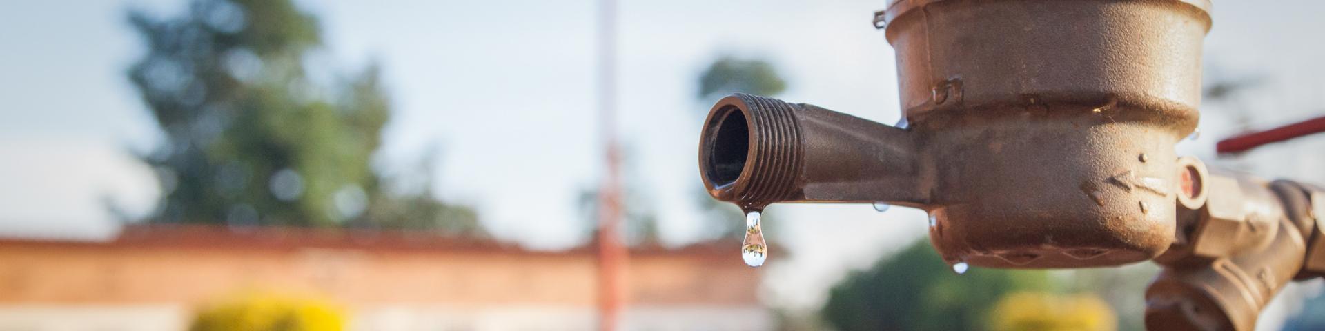 A water drop on a tap in Rwanda